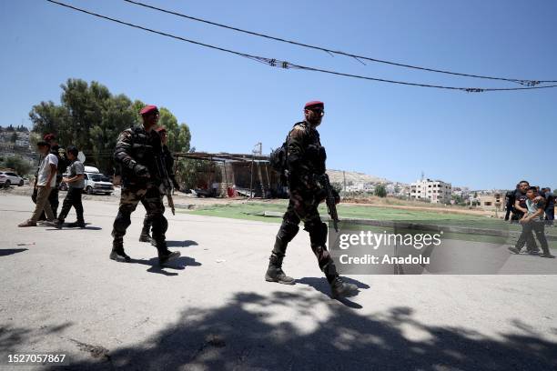 Security measures are taken as the Palestinian President Mahmoud Abbas attends the funeral ceremony of the 12 Palestinians who lost their lives in...