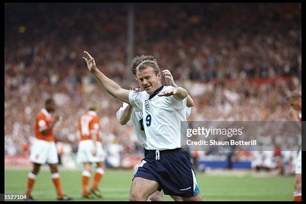 Alan Shearer of England celebrates his second and England's third goal against Holland in the Group A match at Wembley during the European Football...