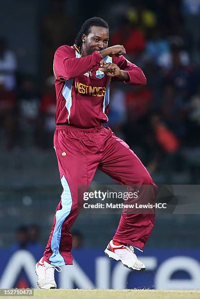 Chris Gayle of the West Indies celebrates the wicket of Gary Wilson of Ireland during the ICC World Twenty20 2012 Group B match between West Indies...