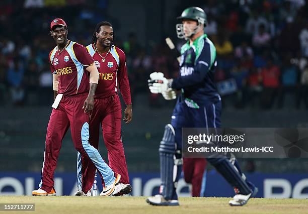 Chris Gayle of the West Indies celebrates the wicket of Niall O'Brien of Ireland with Darren Sammy during the ICC World Twenty20 2012 Group B match...