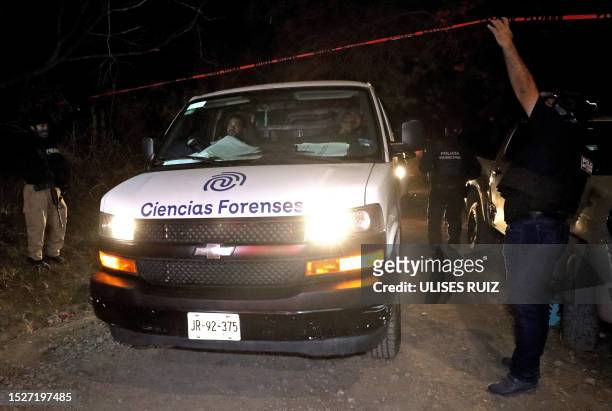 Forensic experts leave the area after collecting evidence following an explosives attack against police officers and staff from the state...