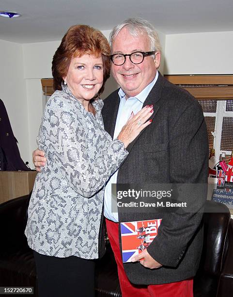 Cilla Black and Christopher Biggins pose backstage during the interval of the press night performance of 'Let It Be' at The Prince Of Wales Theatre...