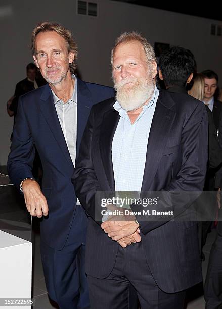 Mike Rutherford and Tony Smith, manager of Genesis, arrive at the EMI Music Sound Foundation fundraiser at Somerset House on September 24, 2012 in...