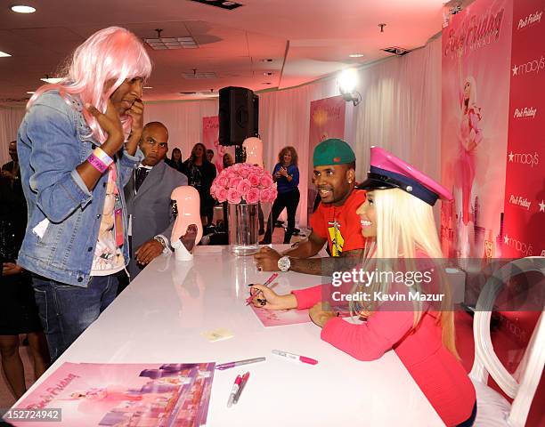 Nicki Minaj signs autographs for fans at her "Pink Friday" fragrance launch at Macy's Herald Square on September 24, 2012 in New York City.