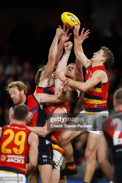 Jordan Dawson of the Crows spoils the ball Peter Wright of the Bombers during the round 17 AFL match between Essendon Bombers and Adelaide Crows at...