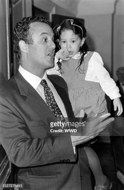 Arthur Becker and daughter Cecilia Becker attend an event at the Wang residence in New York City on December 8, 1994.