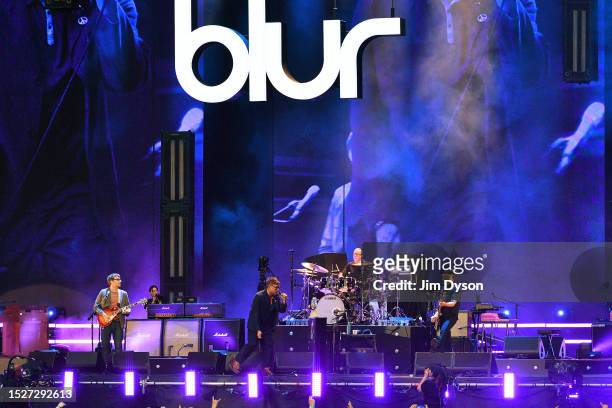Graham Coxon, Damon Albarn, Dave Rowntree and Alex James of Blur perform at Wembley Stadium on July 08, 2023 in London, England.