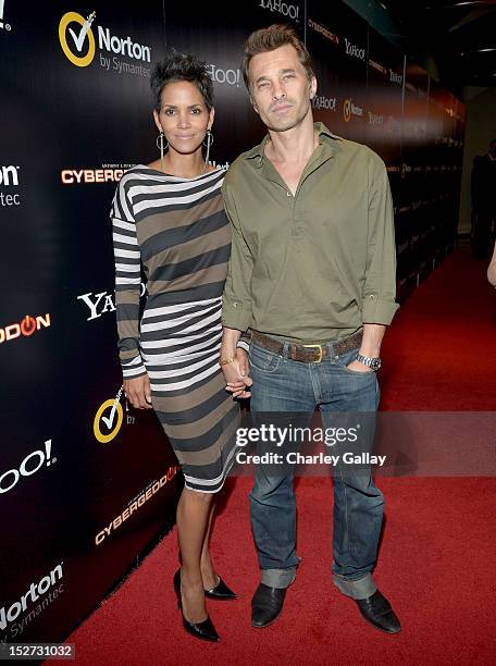 Actors Halle Berry and Olivier Martinez attend the "Cybergeddon" Premiere at Pacific Design Center on September 24, 2012 in West Hollywood,...