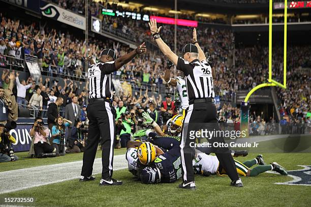 Wide receiver Golden Tate of the Seattle Seahawks makes a catch in the end zone to defeat the Green Bay Packers on a controversial call by the...