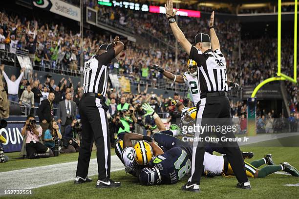 Wide receiver Golden Tate of the Seattle Seahawks makes a catch in the end zone to defeat the Green Bay Packers on a controversial call by the...