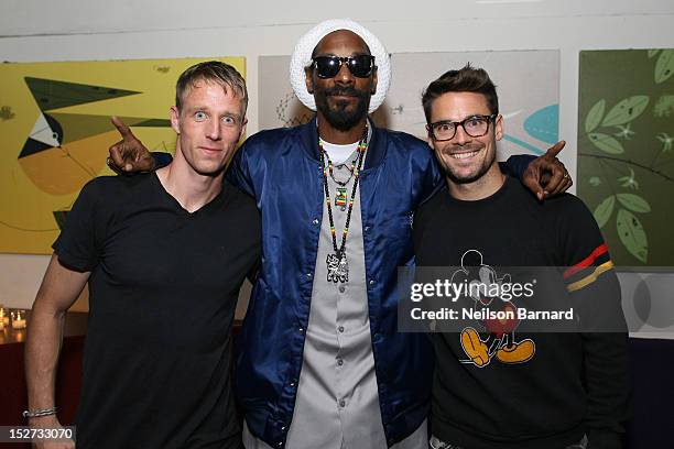 Jan Gunnar Solli and Heath Pearce of The New York Red Bulls and Snoop Lion attend the FIFA Soccer 13 launch tournament at SPiN New York on September...