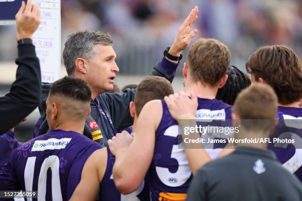 Justin Longmuir, Senior Coach of the Dockers talks to the players at quarter time during the round 17 AFL match between Fremantle Dockers and Carlton...