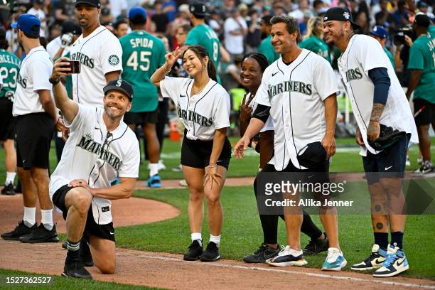 Joel McHale takes a selfie with Chloe Kim, Natasha Watley, Bret Boone, and Felix Hernandez before the 2023 MLB All-Star Celebrity Softball Game at...