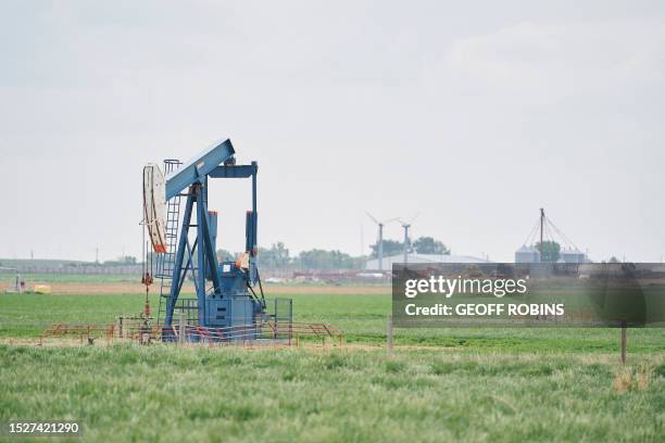 Dormant oil well sits in a field near Taber, Alberta, Canada, on May 25, 2023. Activists and experts say the existence of these inactive oil and gas...