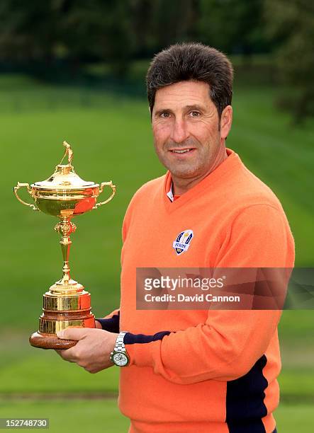 European Team captain Jose Maria Olazabal poses with the trophy during the second preview day of The 39th Ryder Cup at Medinah Country Golf Club on...