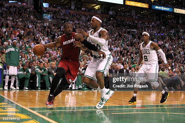 Dwyane Wade of the Miami Heat drives against Paul Pierce and Rajon Rondo of the Boston Celtics in Game Six of the Eastern Conference Finals in the...