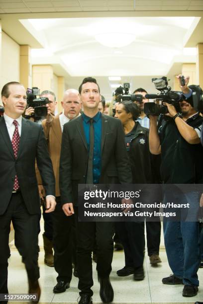 David Daleiden, center, shows up to the Harris County Criminal Court with his legal, Thursday, Feb. 4 in Houston.