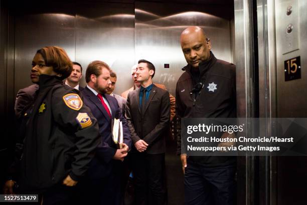 David Daleiden, center, and his attorneys take the elevator to show up at the 11th Court of the Harris County Criminal Court, Thursday, Feb. 4 in...