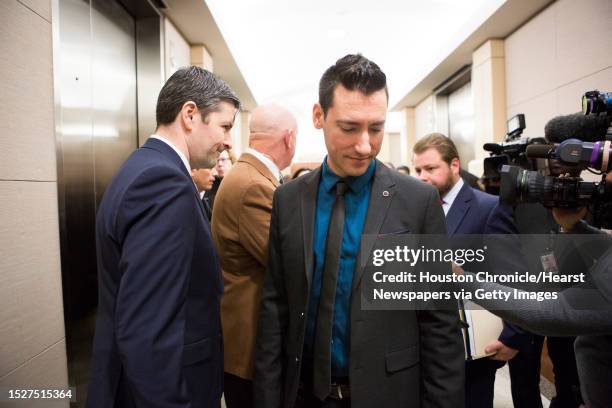 David Daleiden, center, and his attorneys take the elevator to show up at the 11th Court of the Harris County Criminal Court, Thursday, Feb. 4 in...
