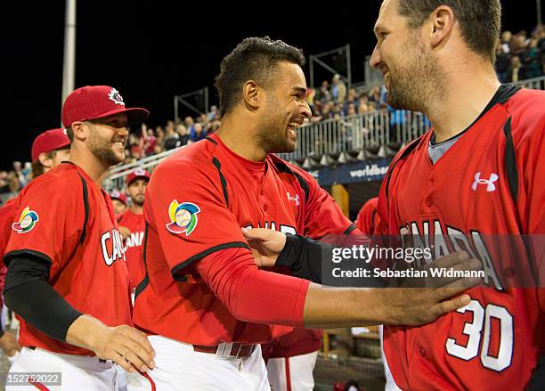 Tyson Gillies, Chris Robinson of Team Canada celebrate after defeating Team Germany in game 6 of the World Baseball Classic Qualifier at Armin-Wolf...