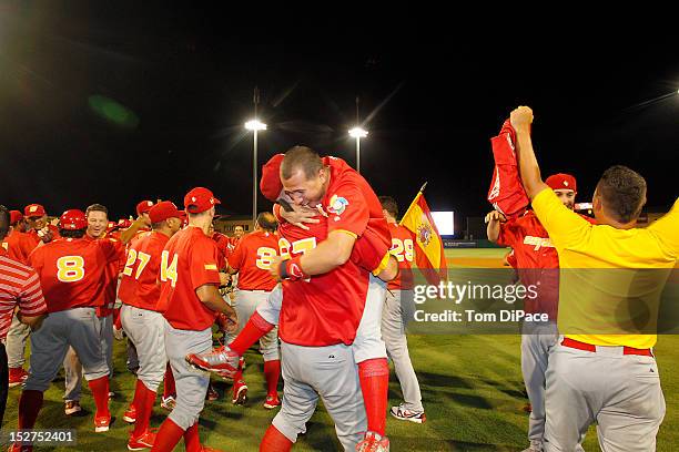 Team Spain celebrates on the field after defeating Team Israel in game 6 of the Qualifying Round of the World Baseball Classic at Roger Dean Stadium...