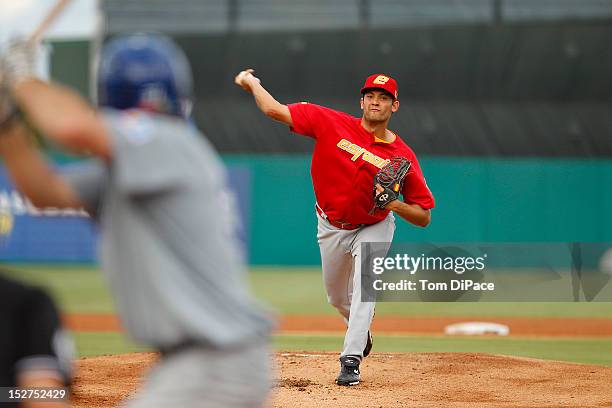 Eric Gonzalez of Team Spain pitches against Team Israel during game 6 of the Qualifying Round of the World Baseball Classic at Roger Dean Stadium on...