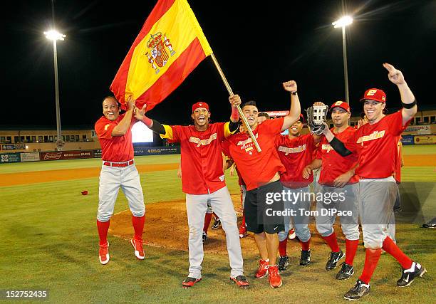 Team Spain celebrates on the field after defeating Team Israel in game 6 of the Qualifying Round of the World Baseball Classic at Roger Dean Stadium...