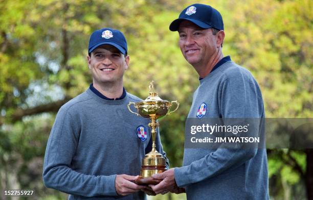 American Ryder Cup Team Captain Davis Love III and Zach Johnson pose at Medinah Country Golf Club in Medinah, Illinois, September 25 ahead of the...