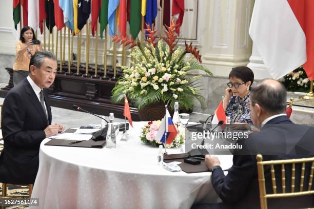 Chinese Communist Party's foreign policy chief Wang Yi Indonesian Foreign Minister Retno Marsudi and Russian Foreign Minister Sergey Lavrov meet...