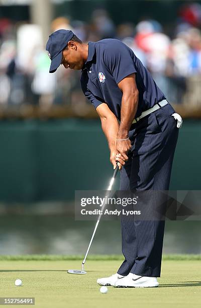 Tiger Woods of the USA hits a putt in a practice round during the second preview day of The 39th Ryder Cup at Medinah Country Golf Club on September...