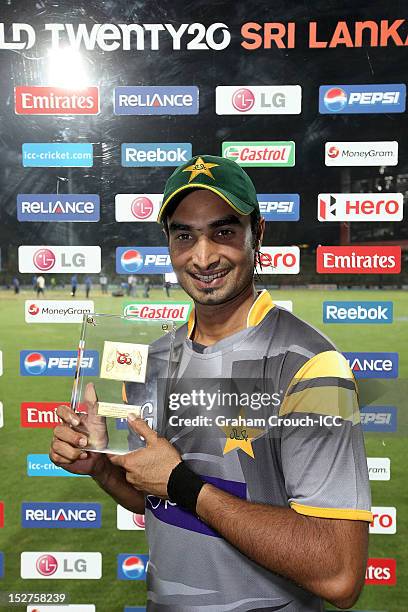 Man of the Match in the Group D match Imran Nazir of Pakistan poses with his Man of the Match award between Pakistan and Bangladesh at Pallekele...