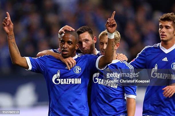 Jefferson Farfan celebrates the first goal with Marco Hoeger, Lewis Holtby and Roman Neustaedter of Schalke during the Bundesliga match between FC...