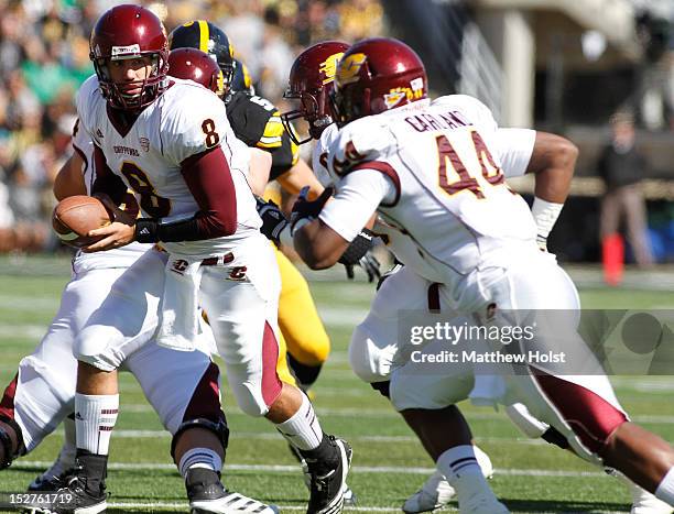 Quarterback Ryan Radcliff of the Central Michigan Chippewas looks to hand off to running back Anthony Garland during the first quarter against the...