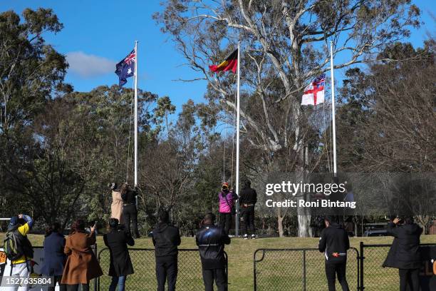 Australian flag, Aboriginal flag and Maori flag raised during the Inaugural International Festival of Indigenous Football at Carbiz Stadium at Camden...