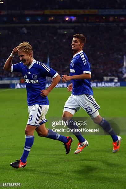 Lewis Holtby celebrates the second goal with Roman Neustaedter of Schalke during the Bundesliga match between FC Schalke 04 and FSV Mainz at...