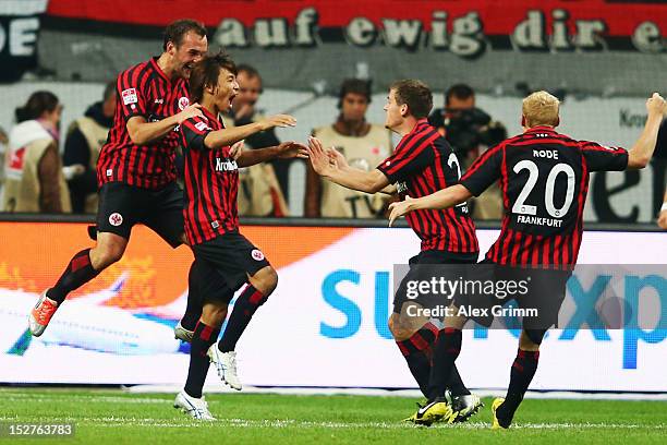 Takashi Inui of Frankfurt celebrates his team's second goal with team mates Stefan Aigner, Sebastian Jung and Sebastian Rode during the Bundesliga...