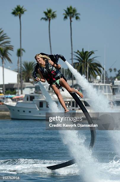Johnnie Faye Carthwright a flight instructor assistant, demonstrates flying using a JetLev, a water-powered Jetpack flying machine in the Newport...