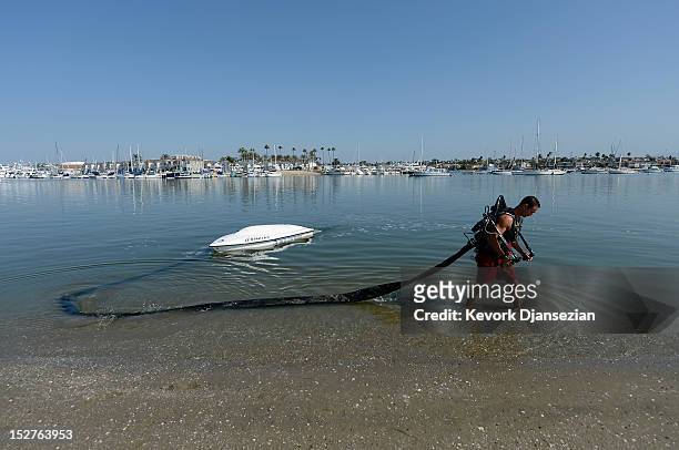 Dean O'Malley demonstrates using a JetLev, a water-powered jetpack flying machine in the Newport Beach harbor on September 25, 2012 in Newport Beach,...