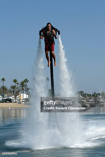 Dean O'Malley flies using a JetLev, a water-powered jetpack flying machine in the Newport Beach harbor on September 25, 2012 in Newport Beach,...
