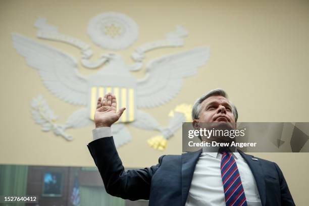 Director Christopher Wray is sworn in during a House Judiciary Committee about oversight of the Federal Bureau of Investigation on Capitol Hill July...