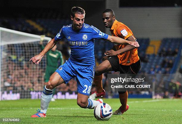 Chelsea's Spanish defender Cesar Azpilicueta vies for the ball with Wolverhampton Wanderers' French midfielder Razak Boukari during the third round...