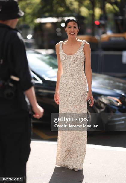 Guest seen outside Ashi Studio show wearing a long slim beige colored dress with beige plateau heels during the Haute Couture Fall/Winter 2023/2024...