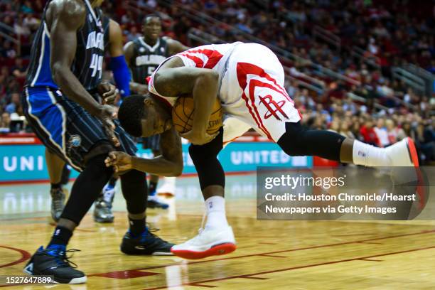 Houston Rockets point guard Aaron Brooks goes head on against Orlando Magic power forward Andrew Nicholson a few seconds before the end of the first...