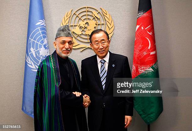 United Nations Secretary-General Ban Ki-moon greets Hamid Karzai, President of Afghanistan during the 67th UN General Assembly meeting on September...