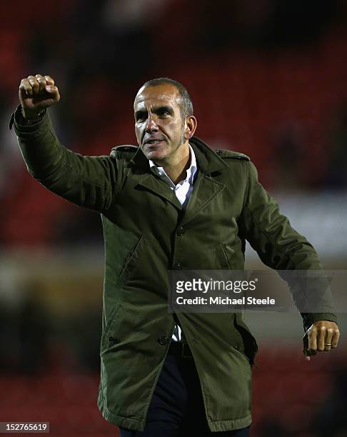 Paolo Di Canio the manager of Swindon Town acknowledges the crowd after his sides 3-1 victory during the Capital One Cup Third Round match between...