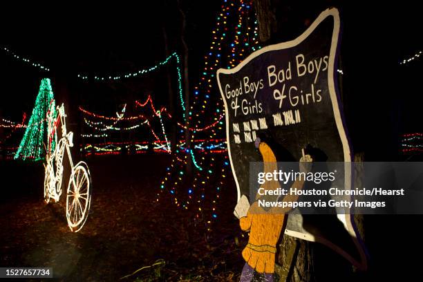 Throughout the Christmas Ranch, iconic holiday themes painted by Bob Hanley and his family are on the path of the light display. Monday, Dec. 9, 2013.