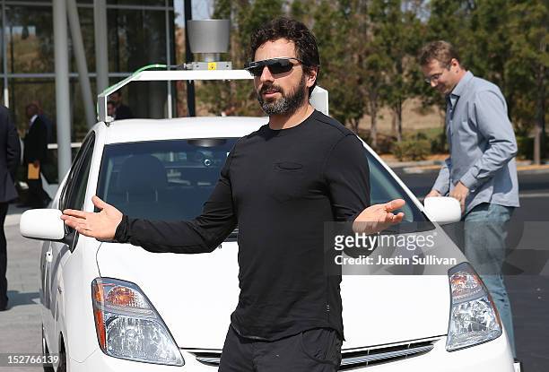 Google co-founder Sergey Brin stands in front of a self-driving car at the Google headquarters on September 25, 2012 in Mountain View, California....