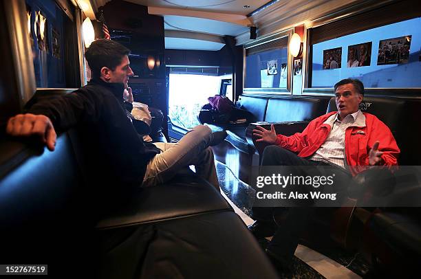 Republican presidential candidate and former Massachusetts Governor Mitt Romney talks with his running mate, U.S. Rep. Paul Ryan in their campaign...