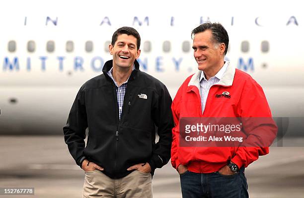 Republican presidential candidate and former Massachusetts Governor Mitt Romney and his running mate, U.S. Rep. Paul Ryan , listen during a campaign...