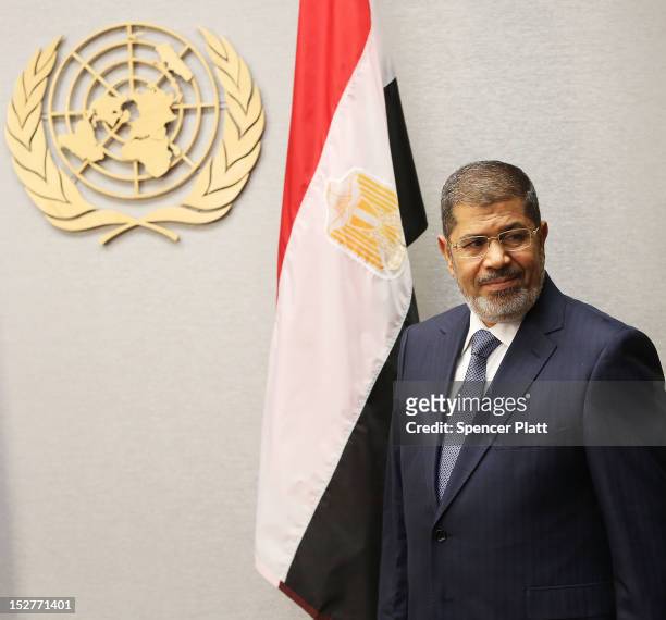 Egyptian President Mohamed Mursi walks into a meeting with United Nations Secretary-General Ban Ki-moon at the United Nations during a meeting at the...